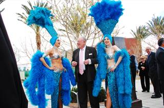 Former Las Vegas Mayor Oscar Goodman, accompanied by his famous showgirls, awaits the unveiling of a bronze bust in his likeness at Symphony Park on Monday, March 12, 2012.